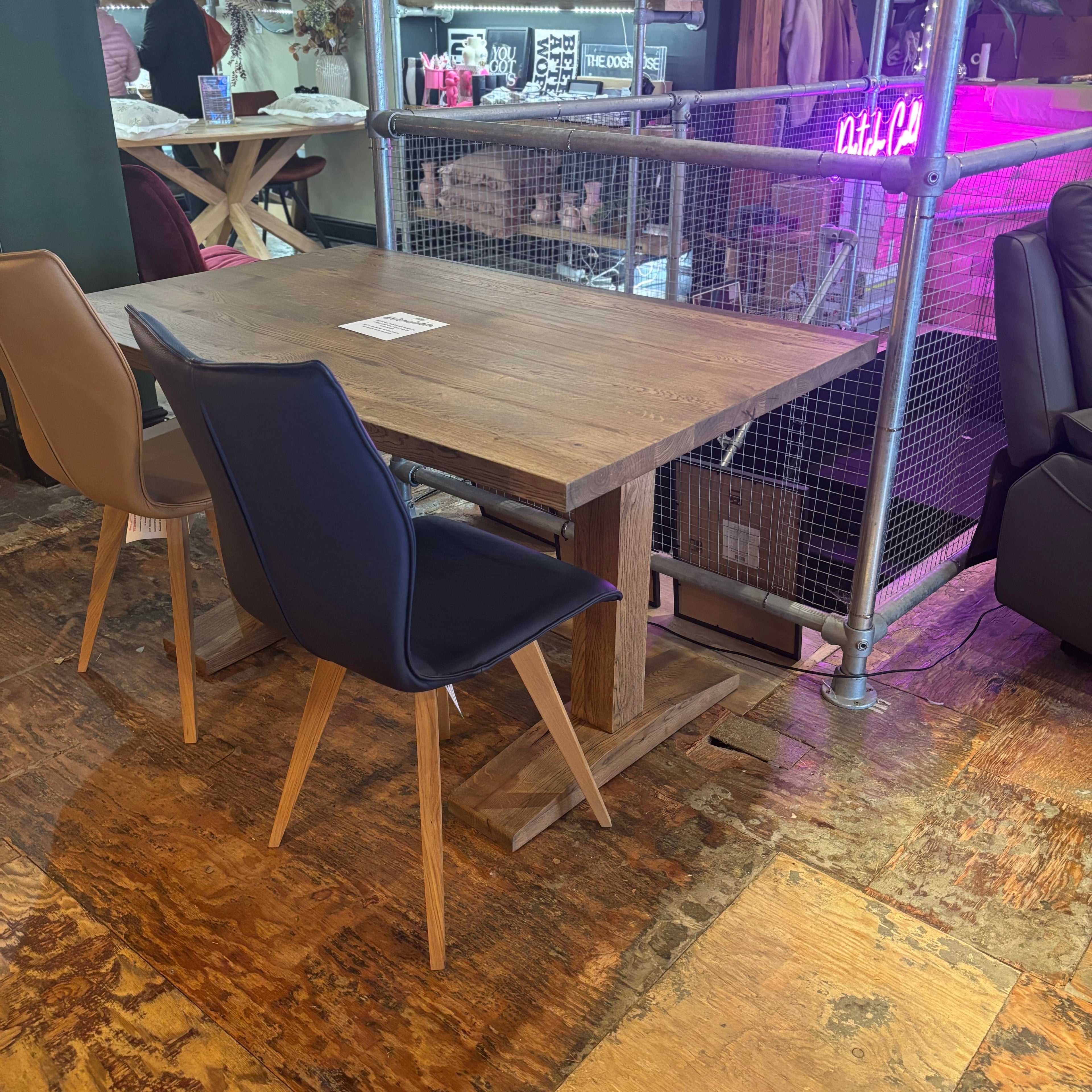 Wooden dining table with chairs in a casual setting