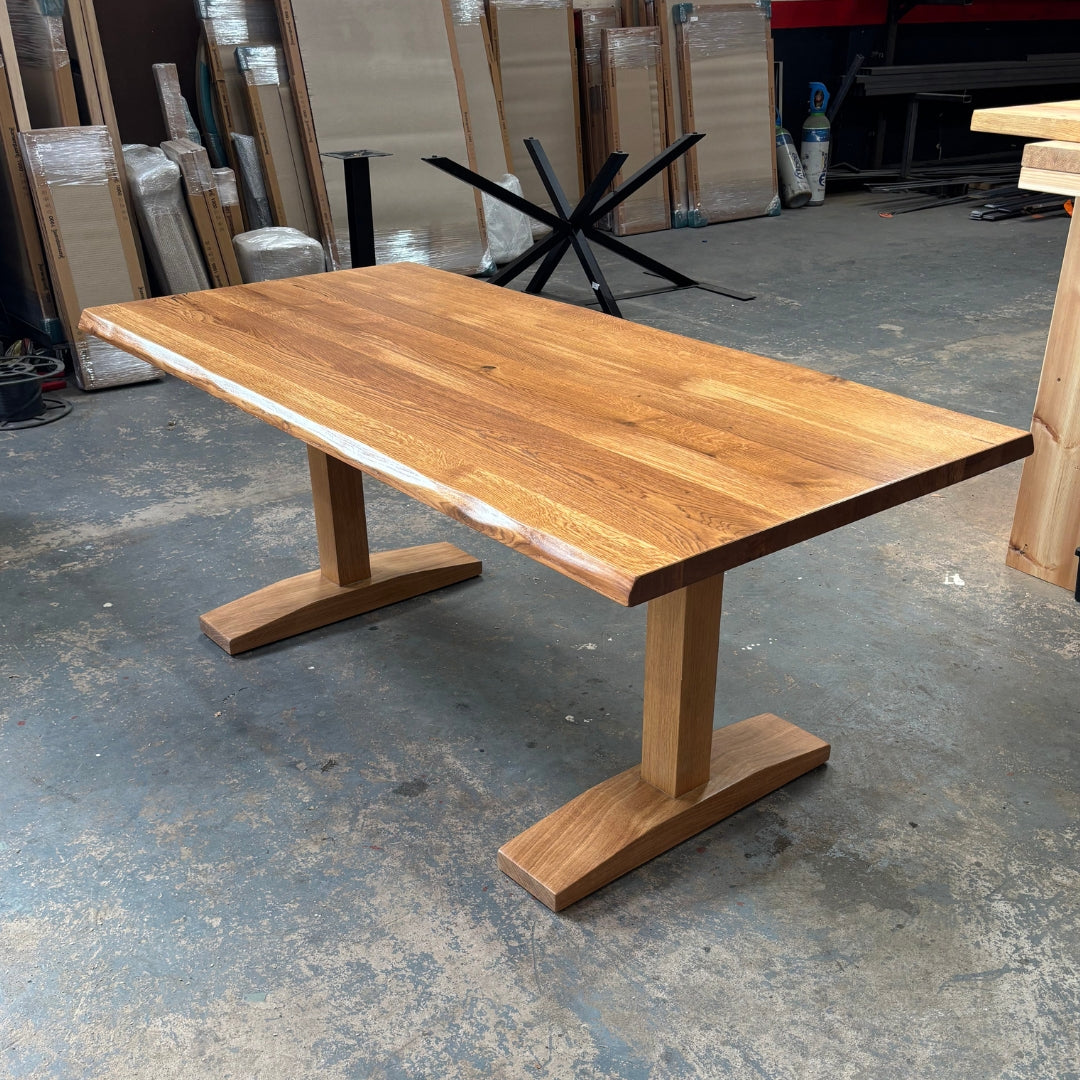 Wooden dining table with a rustic design in a workshop setting