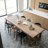 Dining table with different chairs in modern kitchen